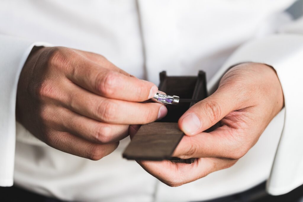 Preparations for the wedding, the groom wears cufflinks